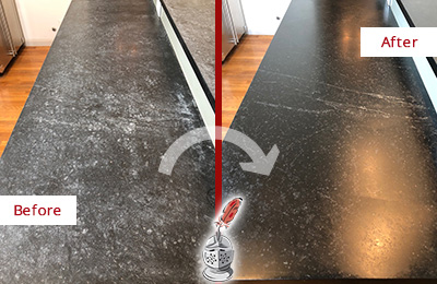 Sir Grout Hones this Worn-Out Stone Countertop for a Smooth Finish Picture of Black Worn-Out Stone Countertop Before and After Honing